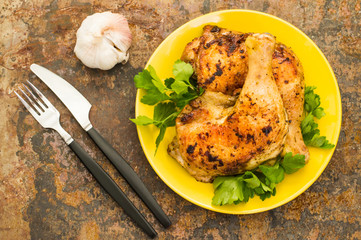Roasted chicken legs on a old background. Top View. Close-up