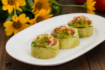 Courgettes stuffed with tomatoes, minced meat, cheese and spices. Wooden background. Close-up
