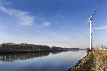 Wind turbines near canal Hartel in Rotterdam