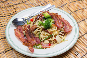 Spicy bacon spaghetti on the plate