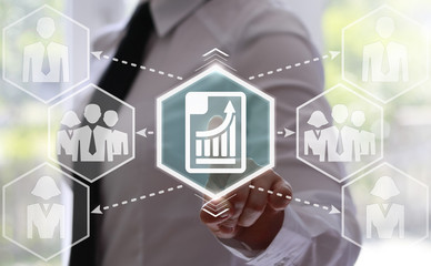 businessman presses paper button with a chart on virtual screens. businesswoman touching the paper icon with a graph on the touch screen. Icon of the paper with a chart. Internet, diagram in business.