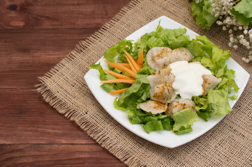 Pelmeni, Traditional Russian dish on a wooden background and sacking. Top view. Close-up