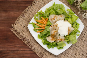 Pelmeni, Traditional Russian dish on a wooden background and sacking. Top view. Close-up