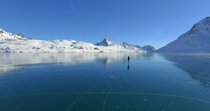 Aerial 4k - Pattinaggio su lago ghiacciato - Passo del Bernina - Svizzera 