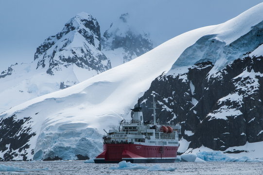 Cruise ship in front of the glaciers and icefields of Danco Island, Antarctica
