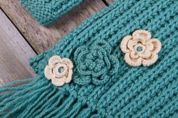 Beautiful knitted hat and scarf with flowers.