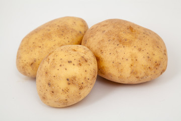 close up of three potatoes