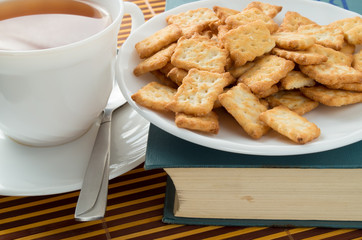View closeup on a cup of tea and dry crackers