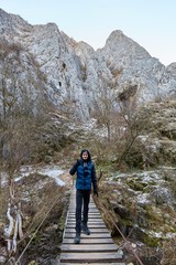 Teenage boy hiking in winter