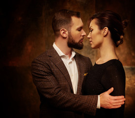 Portrait of well-dressed couple in expression of feelings