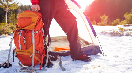 A man holding a backpack.