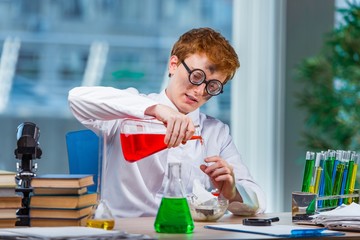 Young crazy chemist working in the lab