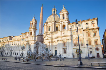 Fototapeta na wymiar Rome - Piazza Navona in morning and Fontana dei Fiumi by Bernini and Egypts obelisk and Santa Agnese in Agone church