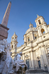 Fototapeta na wymiar Rome - Piazza Navona in morning and Fontana dei Fiumi by Bernini and Egypts obelisk and Santa Agnese in Agone church