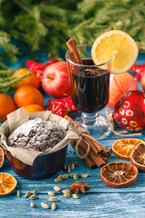 Hot wine drinks with spicy and sweet arrangement, Shot on old wo