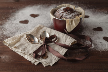 fresh chocolate muffin in a ramekin with spoon