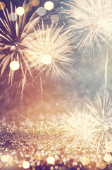 Fototapeta premium Vintage gold and green Fireworks and bokeh in New Year eve and copy space. Abstract background holiday.