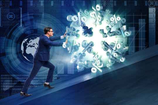 Businessman pushing away high interest rates