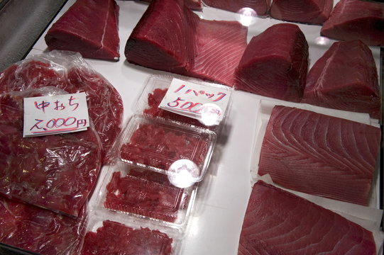 Raw maguro (tuna sashimi) for sale at Tsukiji Wholesale Fish Market, the world's largest fish market in Tokyo, Japan