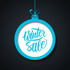 Winter Sale. Special offer banner with handwritten text design and christmas ball. Vector illustration.