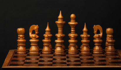 White chess figures on wood board. Set of chess figures.