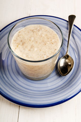creamy porridge in a glass on plate
