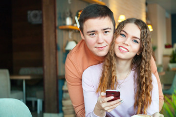 woman and a man in cafe