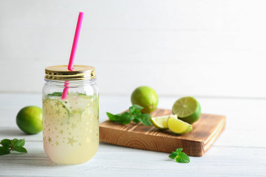Lime lemonade in mason jar on wooden table