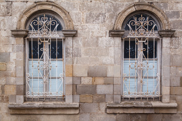 Window in old building with rusty lattice.