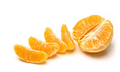 Mandarin, tangerine citrus fruit isolated on white background. Pile of a fresh oranges and several segment of peeled citrus.