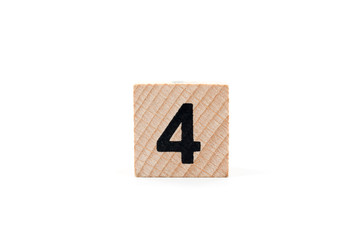 Wooden block Number four on white background.