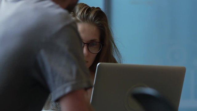 Beautiful woman with glasses using a laptop computer