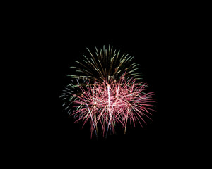 Fototapeta premium Fireworks of various colors isolated on black background