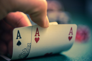 man shows two aces in poker