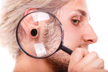 Teen boy with piercing and fashionable hairstyle