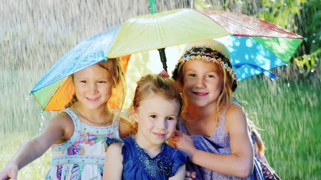 three sisters are hiding under the umbrella of color.