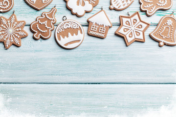 Christmas wooden background with gingerbread cookies