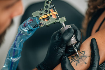 Tattoo artist working
