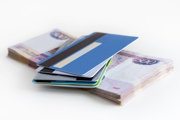 Bank cards in hand on the background of banknote