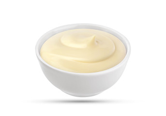 Mayonnaise sauce in bowl isolated on white background with clipping path