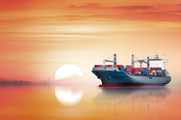 International Container Cargo ship in the ocean as sunset sky, Freight Transportation, Shipping