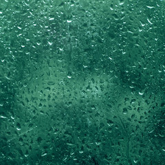 Rainy wet cold blue abstract eco seasonal natural blurred background with water drops