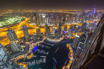 Dubai Marina district from a rooftop at night. Dubai, UAE.