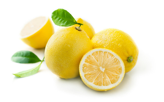 Ripe juicy lemon with leaf isolated on white