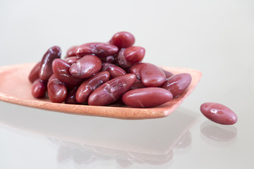 Red beans in a wooden ladle