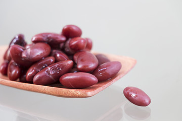 Red beans in a wooden ladle