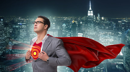 Businessman in superhero concept with red cover