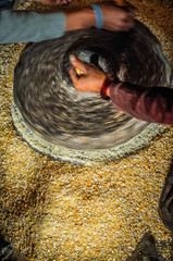 Spinning corn grinder © michalknitl