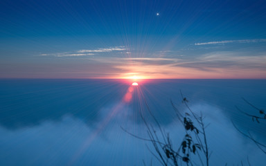 lighting flare effect onBeautiful foggy sunrise landscape in the morning at Phetchabun District, Thailand. Photo taken on: 29 November , 2016