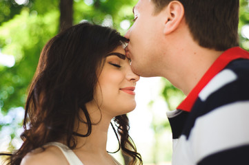 Fototapeta premium lovely happy couple at summer park